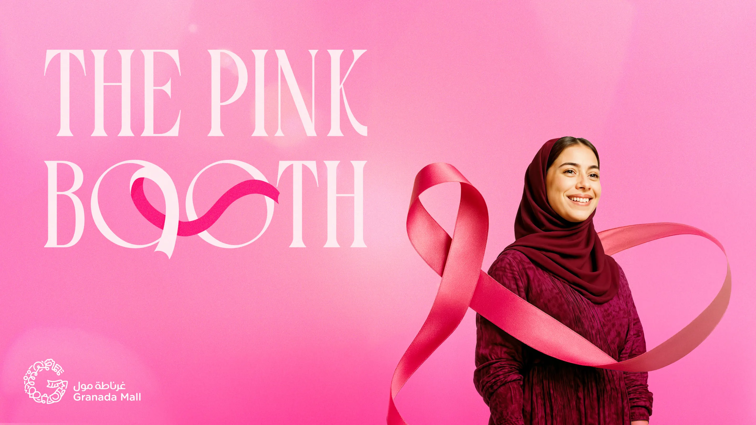 The Pink Booth key visual for Granada Mall: a smiling woman in a pink hijab wrapped in a pink ribbon